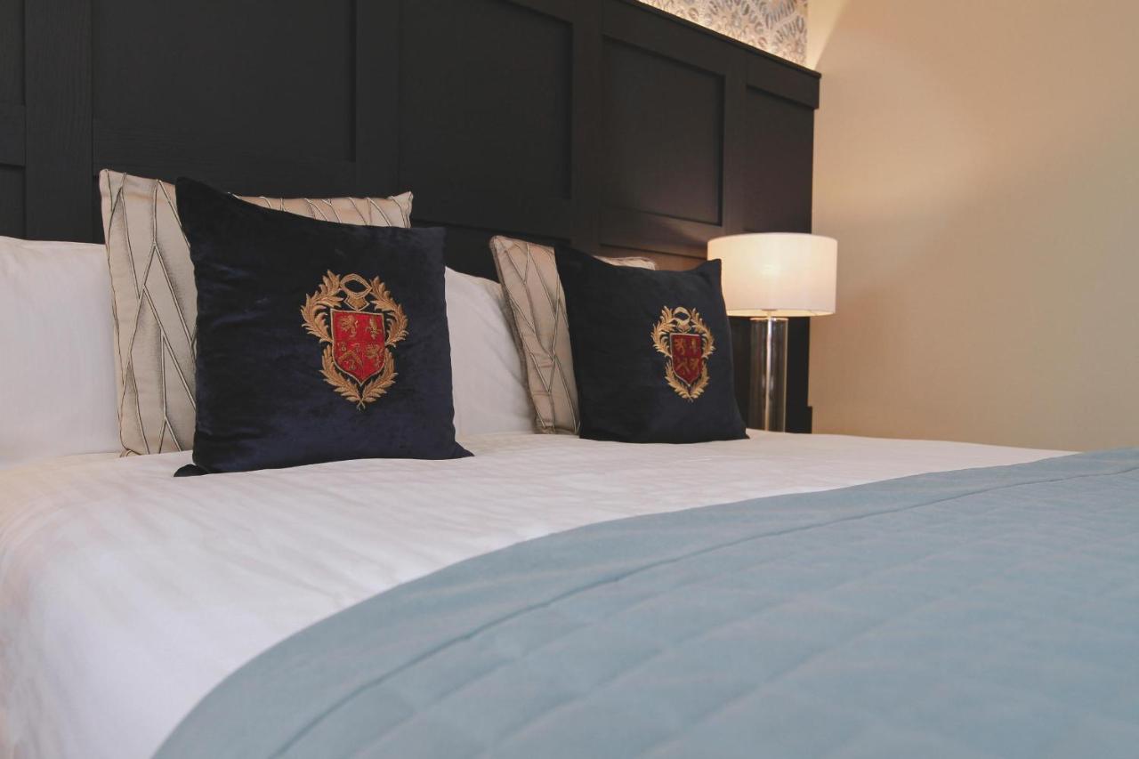 Boringdon Hall Hotel And Spa Plymouth Exterior photo A bed with a headboard